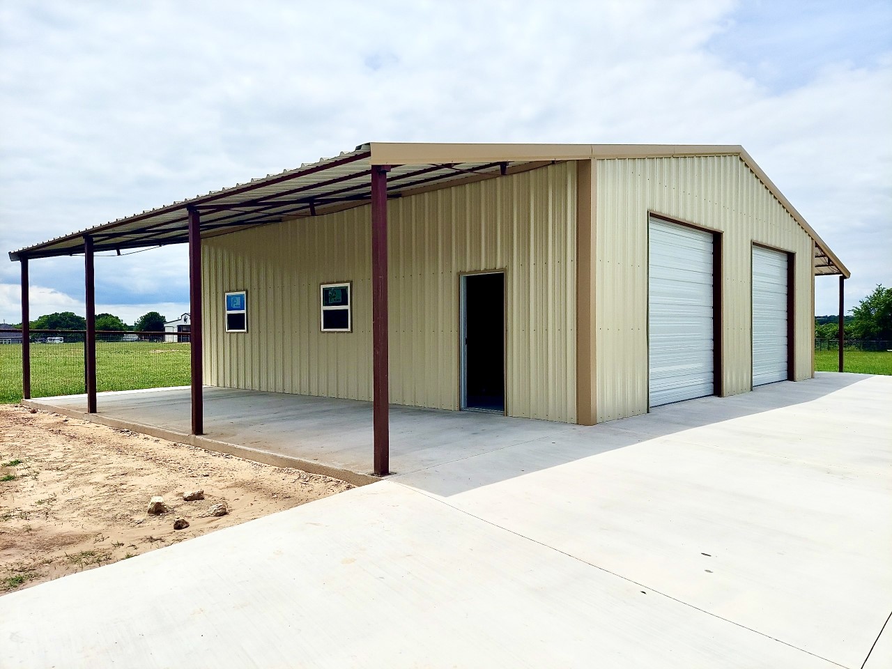 A large building with two doors and a metal roof.